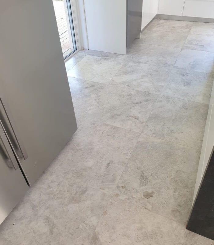 Pearl Honed Marble natural stone tiles as a kitchen floor.