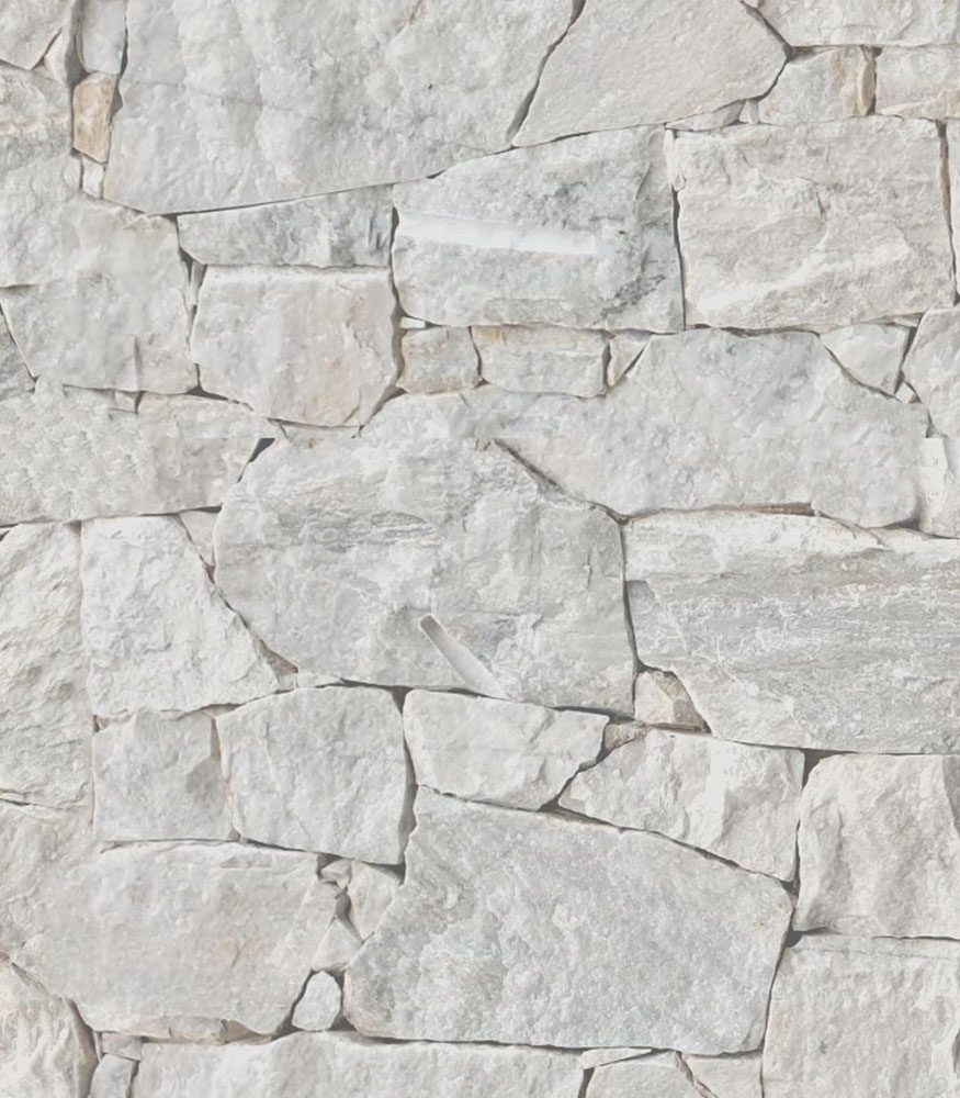 Quarzite pieces dry-stacked to create a feature wall. The stones are grey, cream and white tones, highlighting the rough texture and stone’s veining.