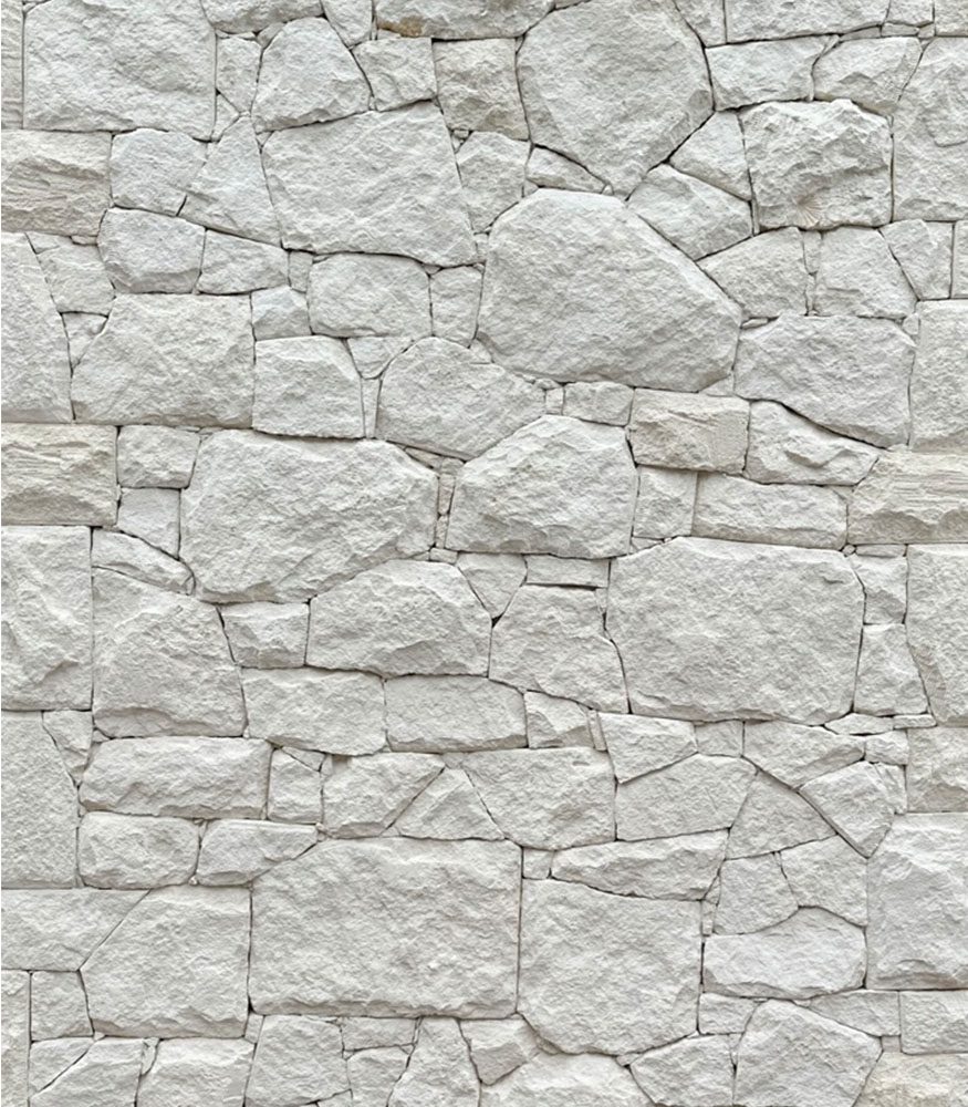 Tumbled’s White limestone was used as wall cladding. The dry stack highlights the creamy colour and texture of the rubble stones.